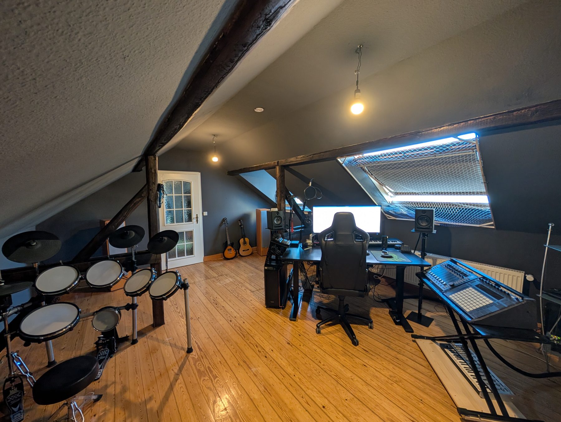Studio desk with synthesizers and monitors